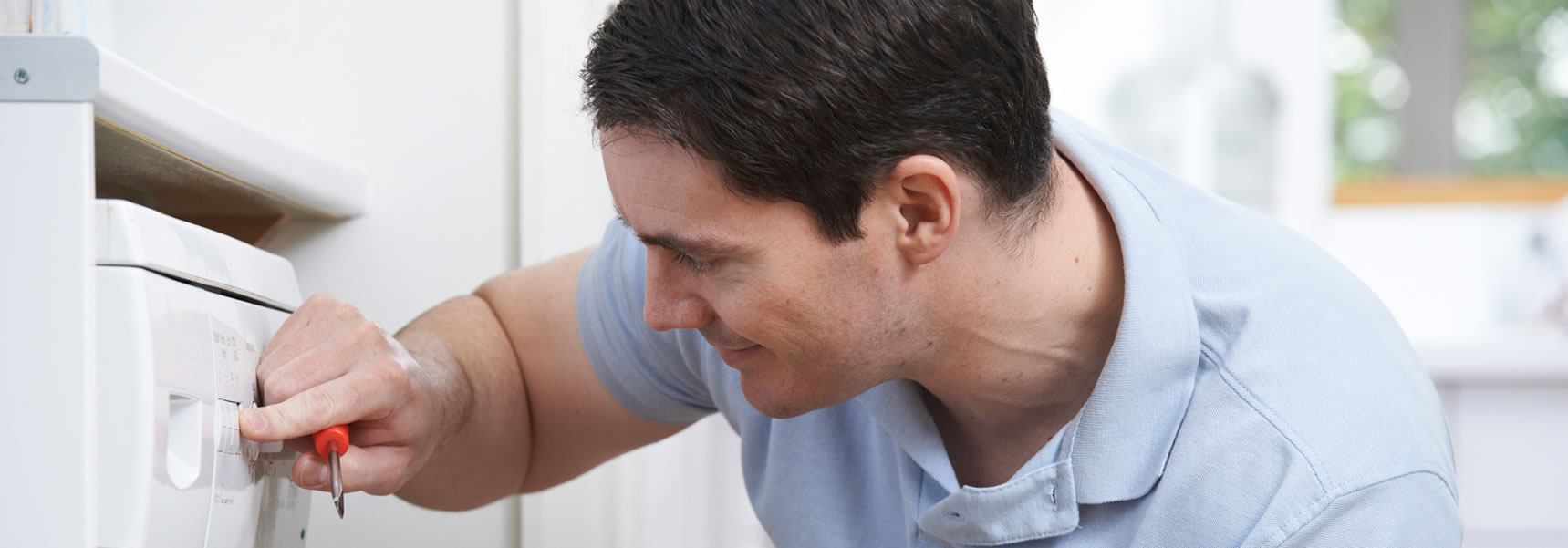 engineer repairing washing machine